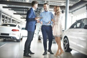 couple-purchasing-brand-new-car